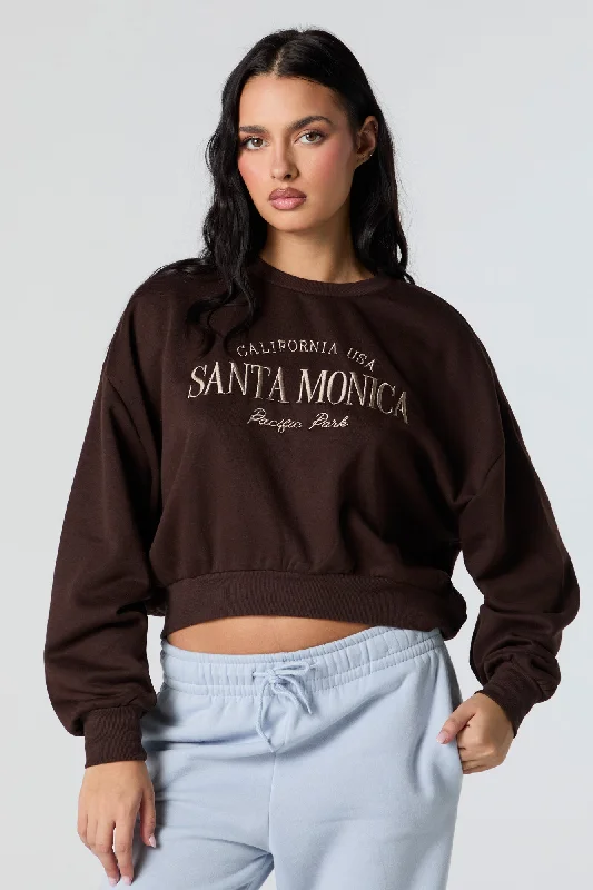 Women's cropped sweatshirt with a slogan graphic for a fun and expressive lookSanta Monica Embroidered Cropped Fleece Sweatshirt Women's cropped sweatshirt with a slogan graphic for a fun and expressive lookSanta Monica Embroidered Cropped Fleece Sweatshirt