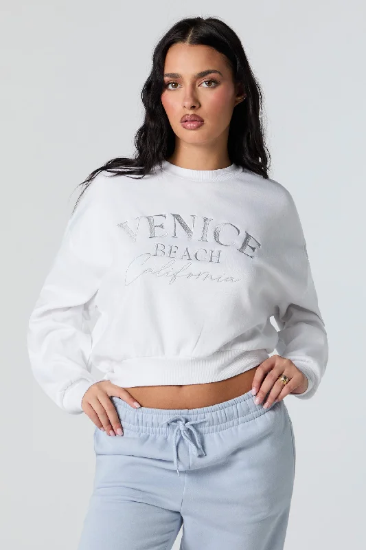 Women's cropped sweatshirt with a lace - trimmed hem for a romantic lookVenice Beach Embroidered Cropped Fleece Sweatshirt Women's cropped sweatshirt with a lace - trimmed hem for a romantic lookVenice Beach Embroidered Cropped Fleece Sweatshirt