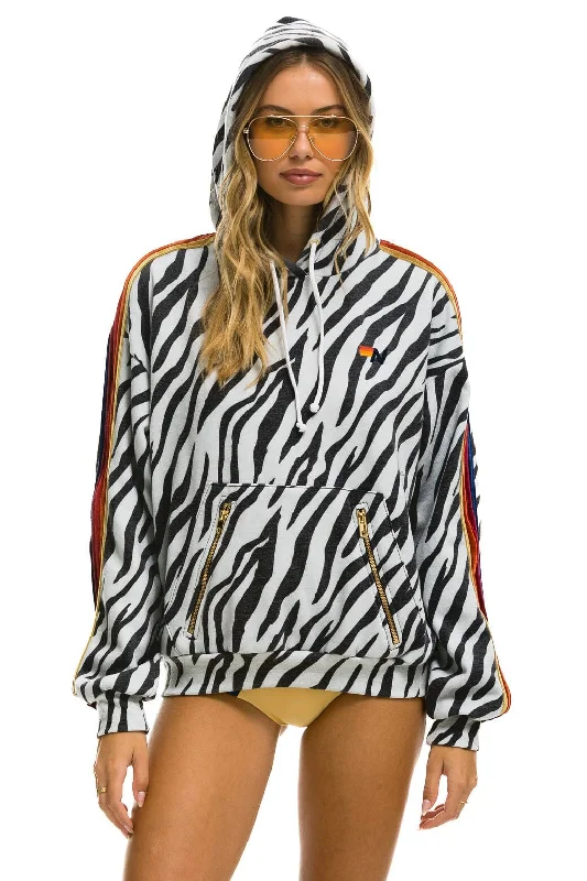 Women's graphic - printed sweatshirt featuring floral patterns for a feminine touchCLASSIC RELAXED PULLOVER HOODIE WITH ZIPPER POCKETS - ZEBRA Women's graphic - printed sweatshirt featuring floral patterns for a feminine touchCLASSIC RELAXED PULLOVER HOODIE WITH ZIPPER POCKETS - ZEBRA