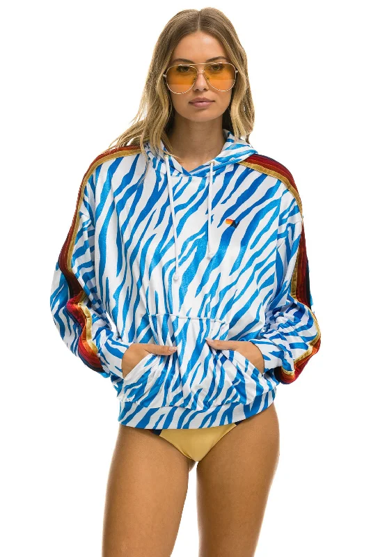 Women's quarter - zip sweatshirt made of organic cotton for eco - conscious fashionCLASSIC VELVET RELAXED PULLOVER HOODIE - BLUE TIGER Women's quarter - zip sweatshirt made of organic cotton for eco - conscious fashionCLASSIC VELVET RELAXED PULLOVER HOODIE - BLUE TIGER