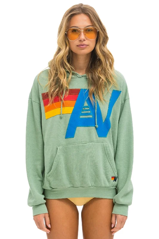 Women's fleece - lined hoodie with thumbholes for warmth in winterLOGO STITCH PULLOVER RELAXED HOODIE - SAGE Women's fleece - lined hoodie with thumbholes for warmth in winterLOGO STITCH PULLOVER RELAXED HOODIE - SAGE